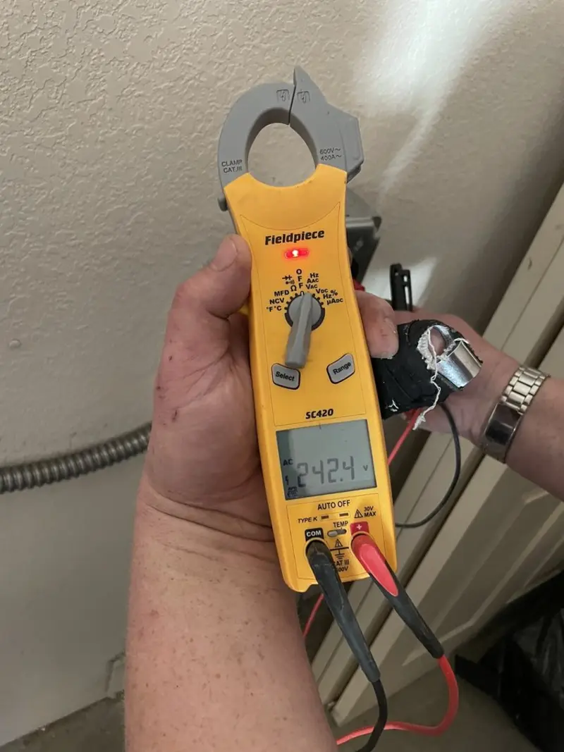 Voltage testing with clamp meter during Electrical Installation Services in Ho-Ho-Kus